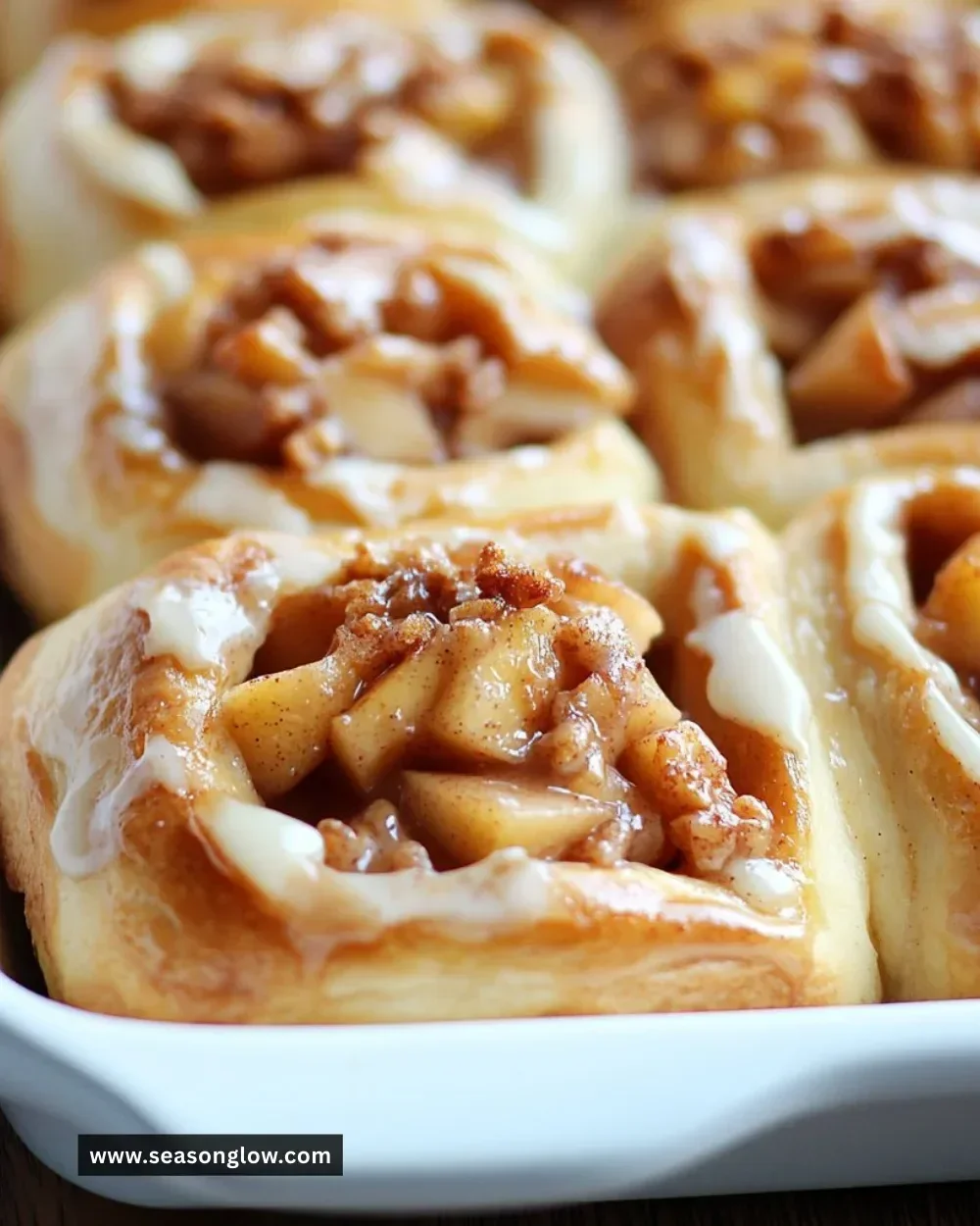 Freshly baked apple cinnamon rolls topped with apple pie filling