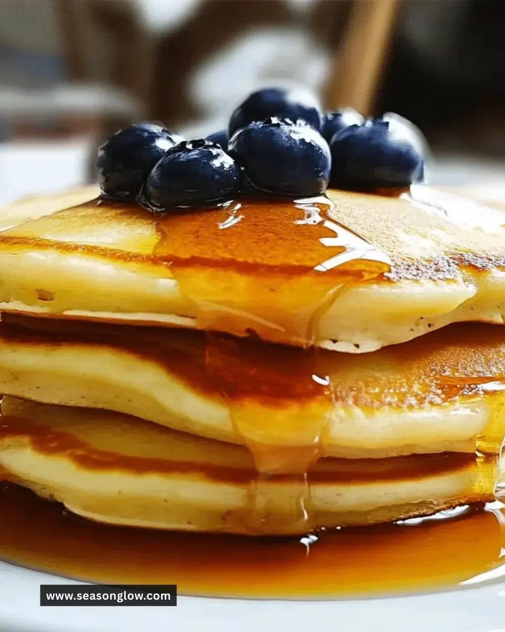 Delicious fluffy pancakes drizzled with honey on a plate
