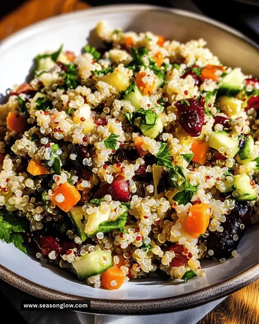 Colorful bowl of Best Harvest Quinoa Salad with fresh vegetables and herbs