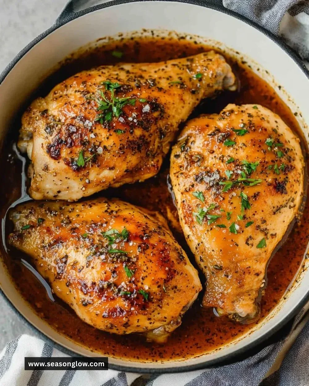 Plate of brown sugar garlic chicken garnished with green onions