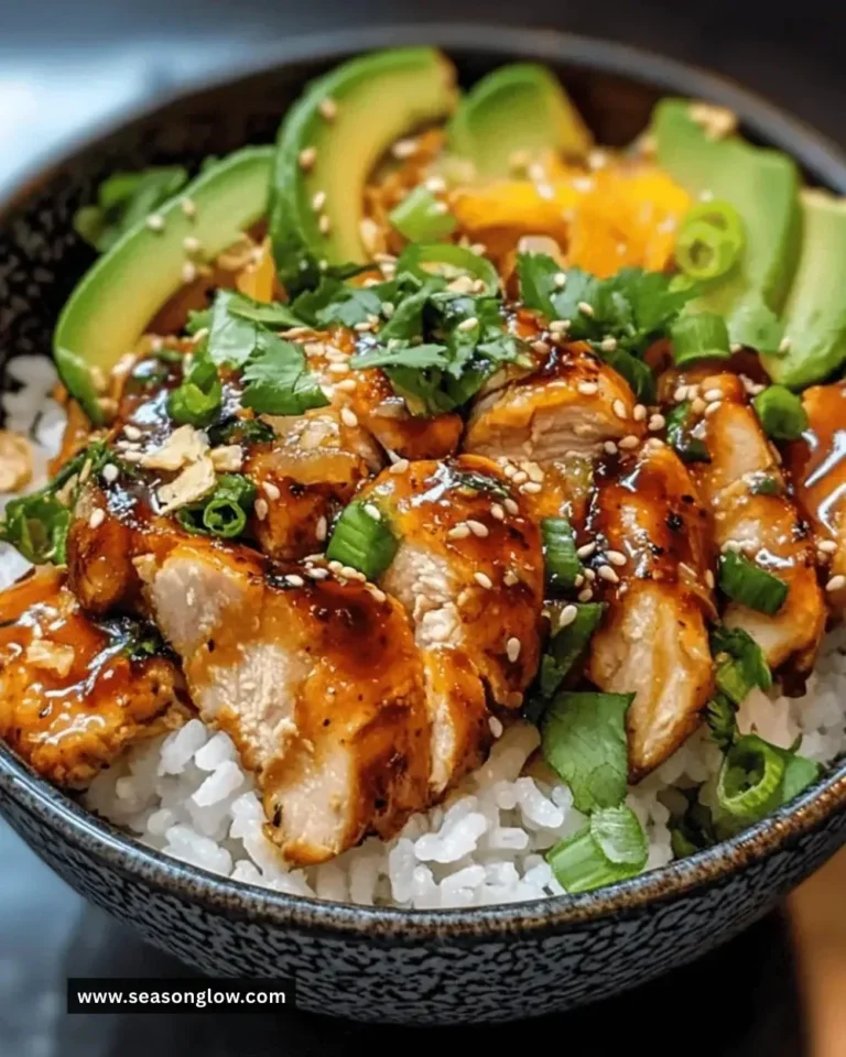 Delicious Asian ginger chicken rice bowl with fresh vegetables and rice