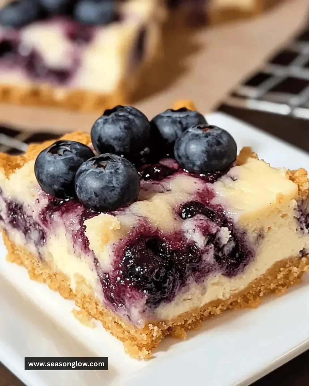 Easy blueberry cheesecake bars topped with fresh blueberries