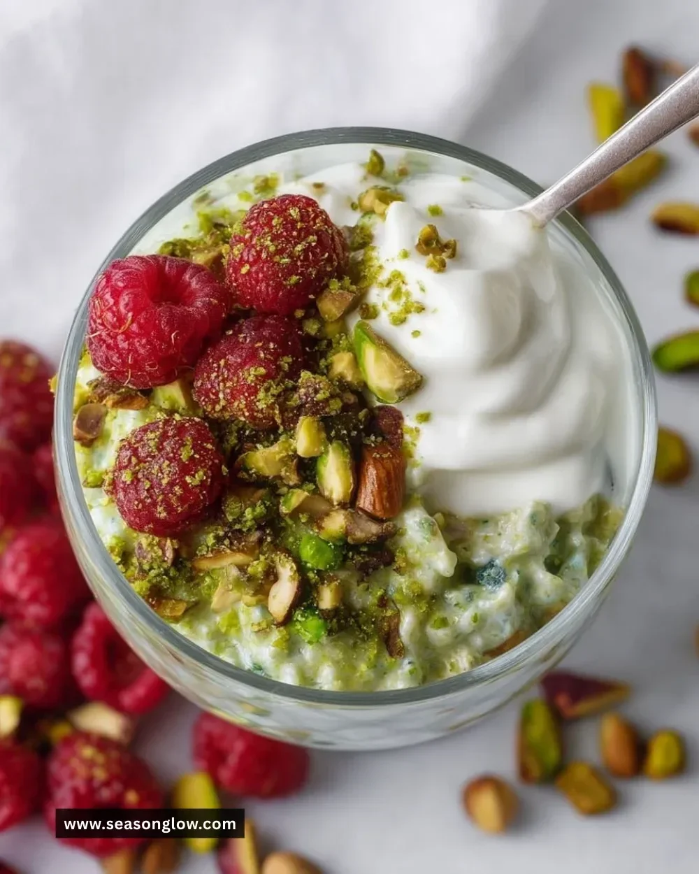 Bowl of easy pistachio overnight oats topped with nuts and fruits