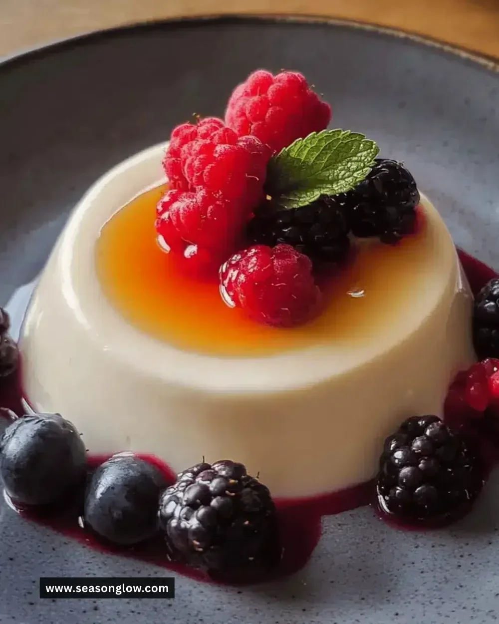 Easy vanilla panna cotta dessert with fresh berries on top