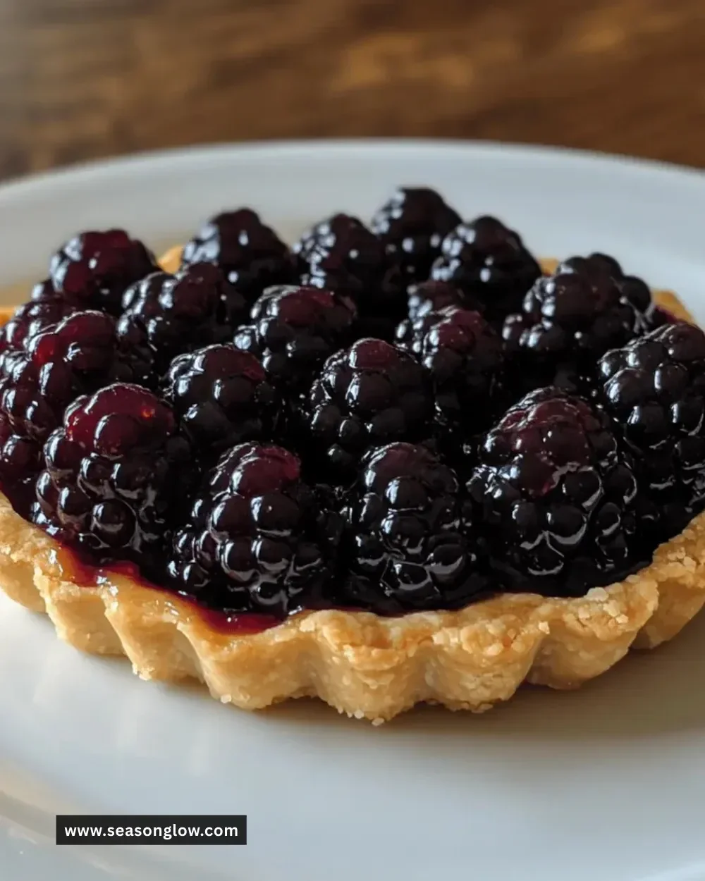 Irresistible easy blackberry tart topped with fresh blackberries and a golden crust.