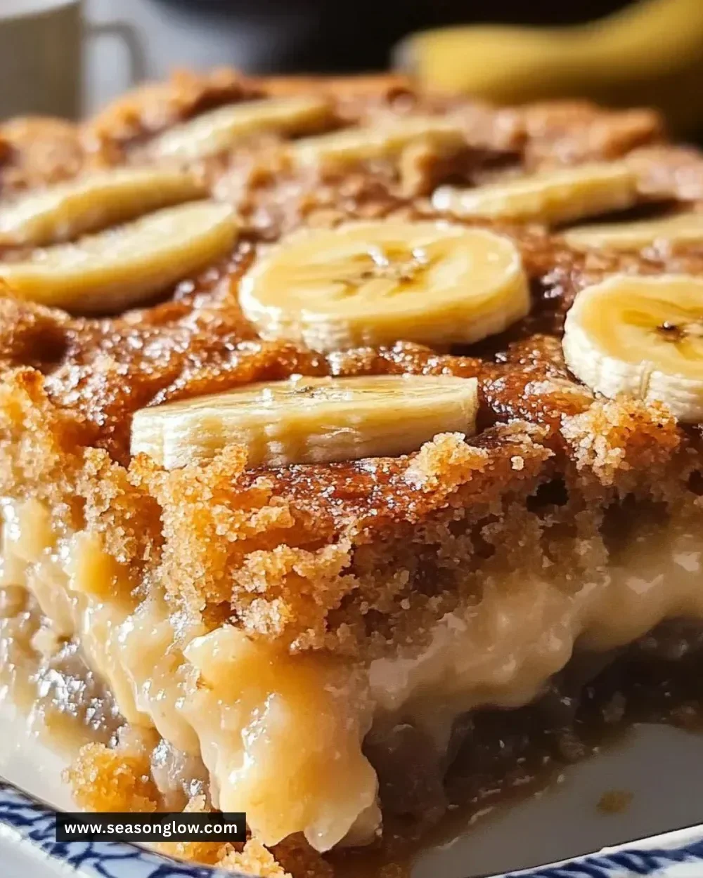 Irresistibly moist banana bread cobbler topped with fresh bananas and streusel.