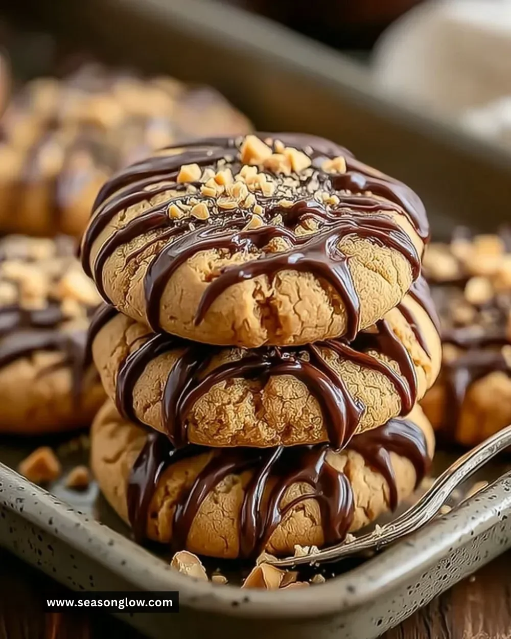 Batch of Snickers peanut butter cookies on a cooling rack
