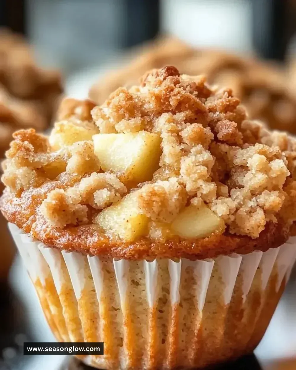 Freshly baked apple crumble muffins with a crunchy topping