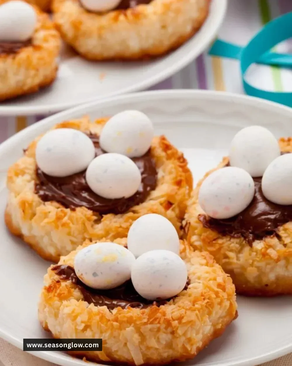 Plate of homemade Birds Nest Cookies decorated with chocolate and candy eggs