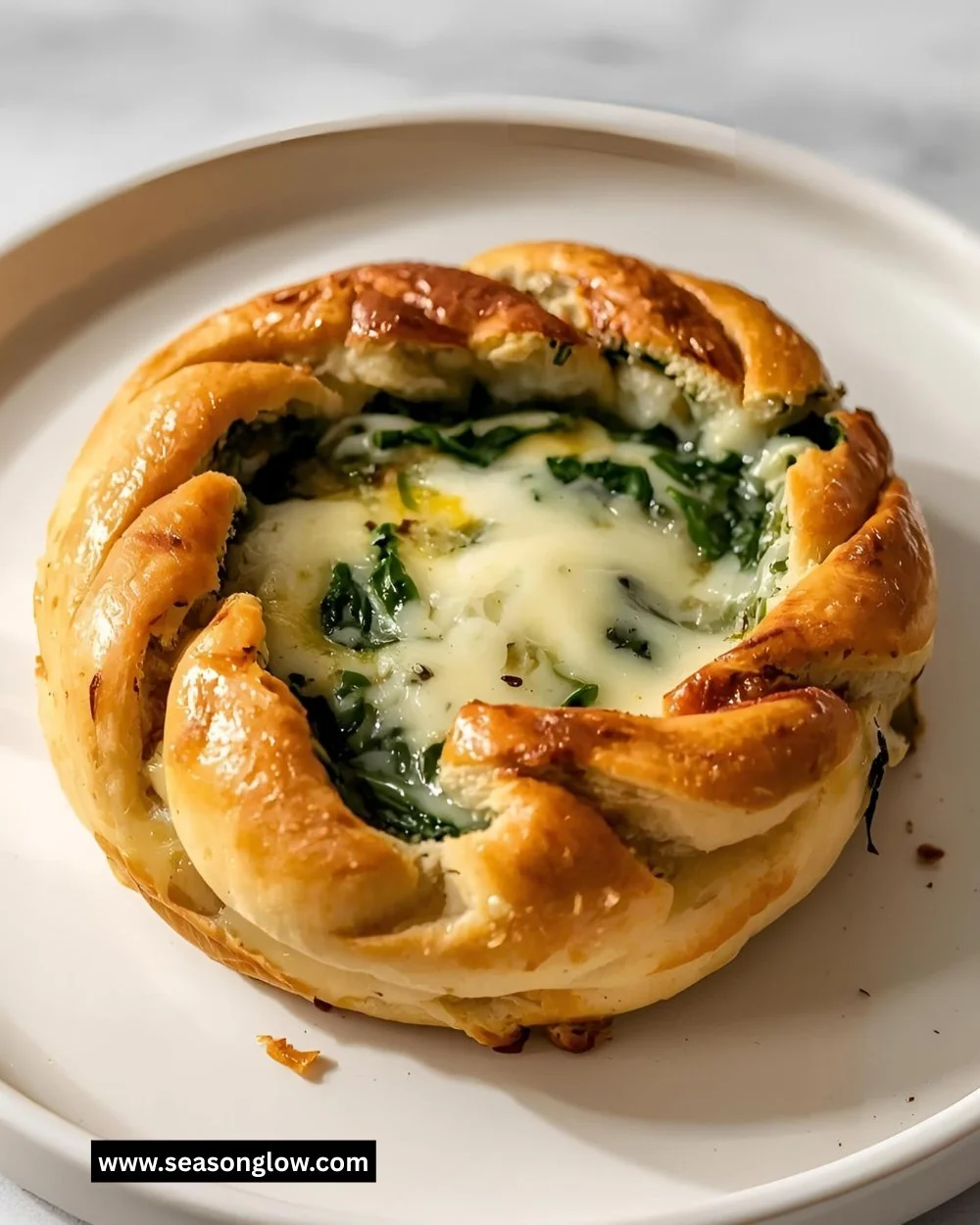 Cheesy spinach stuffed bread with melted cheese and fresh spinach filling