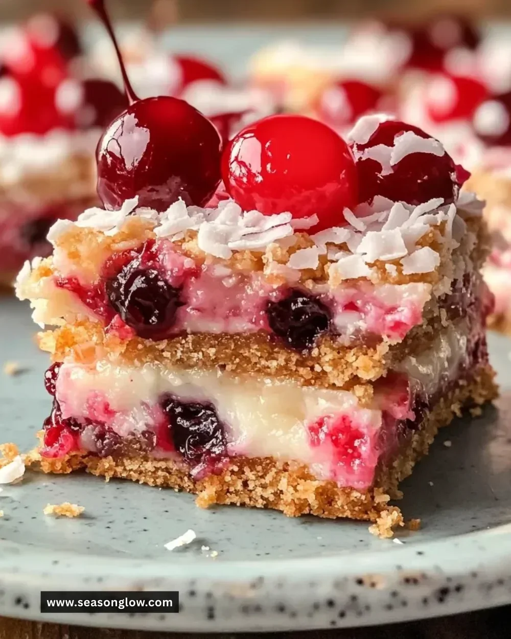 Deliciously chewy Cherry Coconut Magic Bars with cherry and coconut toppings