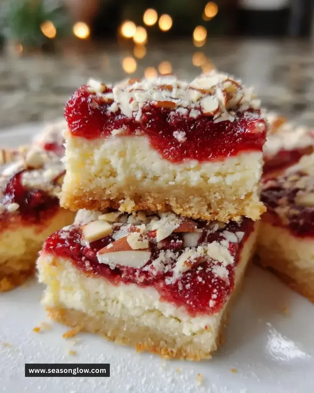Delicious Christmas cheesecake bars with festive toppings on a white plate