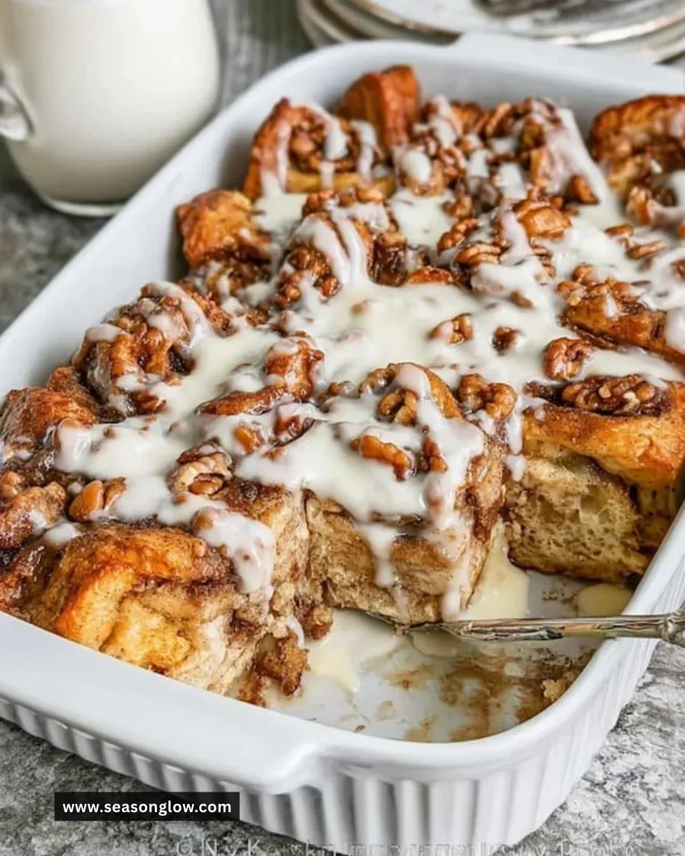 Delicious Cinnamon Roll French Toast Casserole served with syrup and berries
