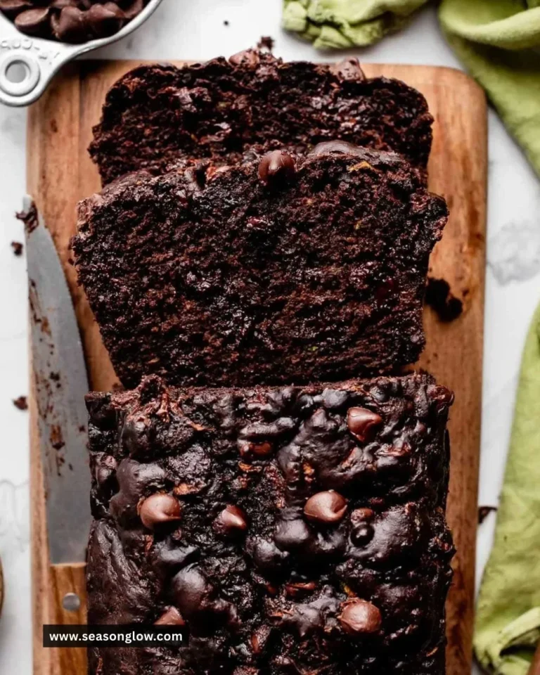 Double chocolate zucchini bread slice with chocolate chips on a plate