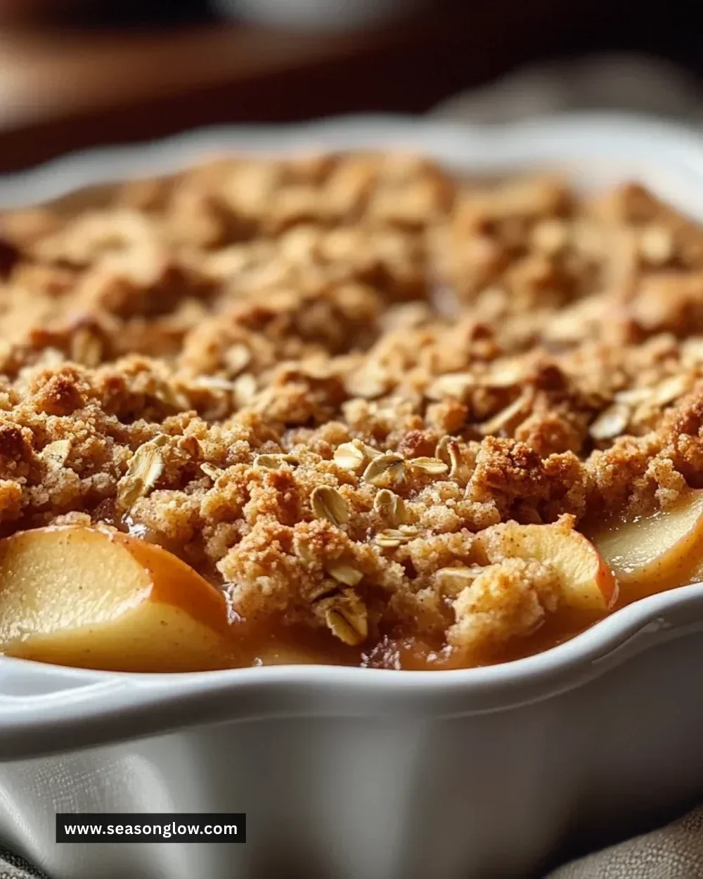 Delicious easy apple crisp with oats served in a bowl with a scoop of ice cream