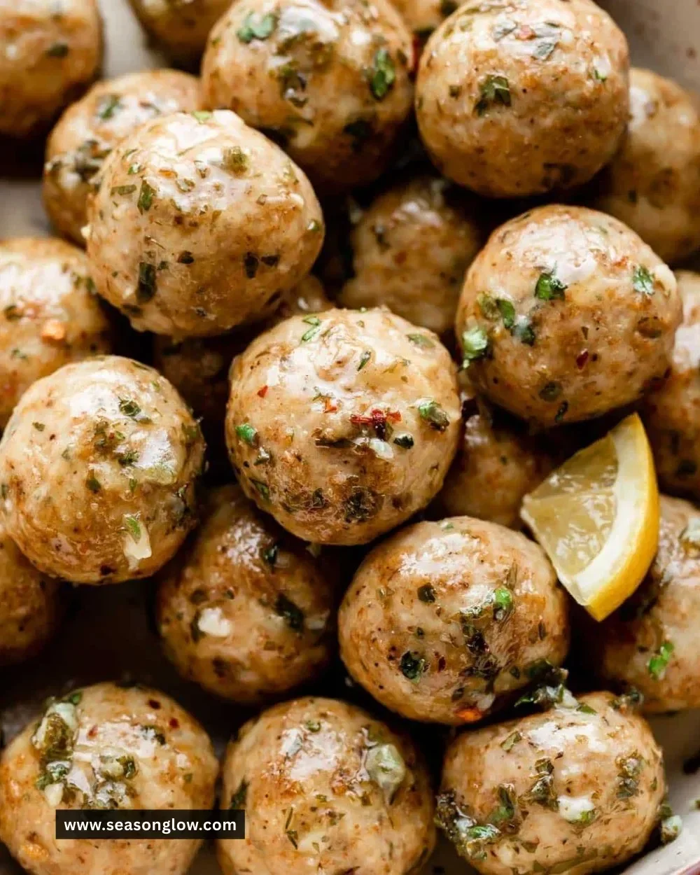 Delicious easy baked chicken meatballs served with marinara sauce