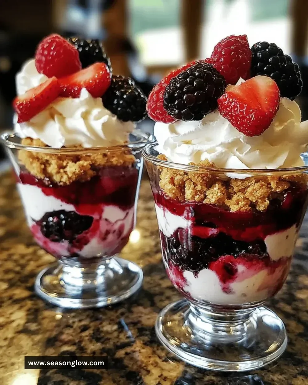 Delicious berry cheesecake parfaits layered with fresh berries and cream cheese
