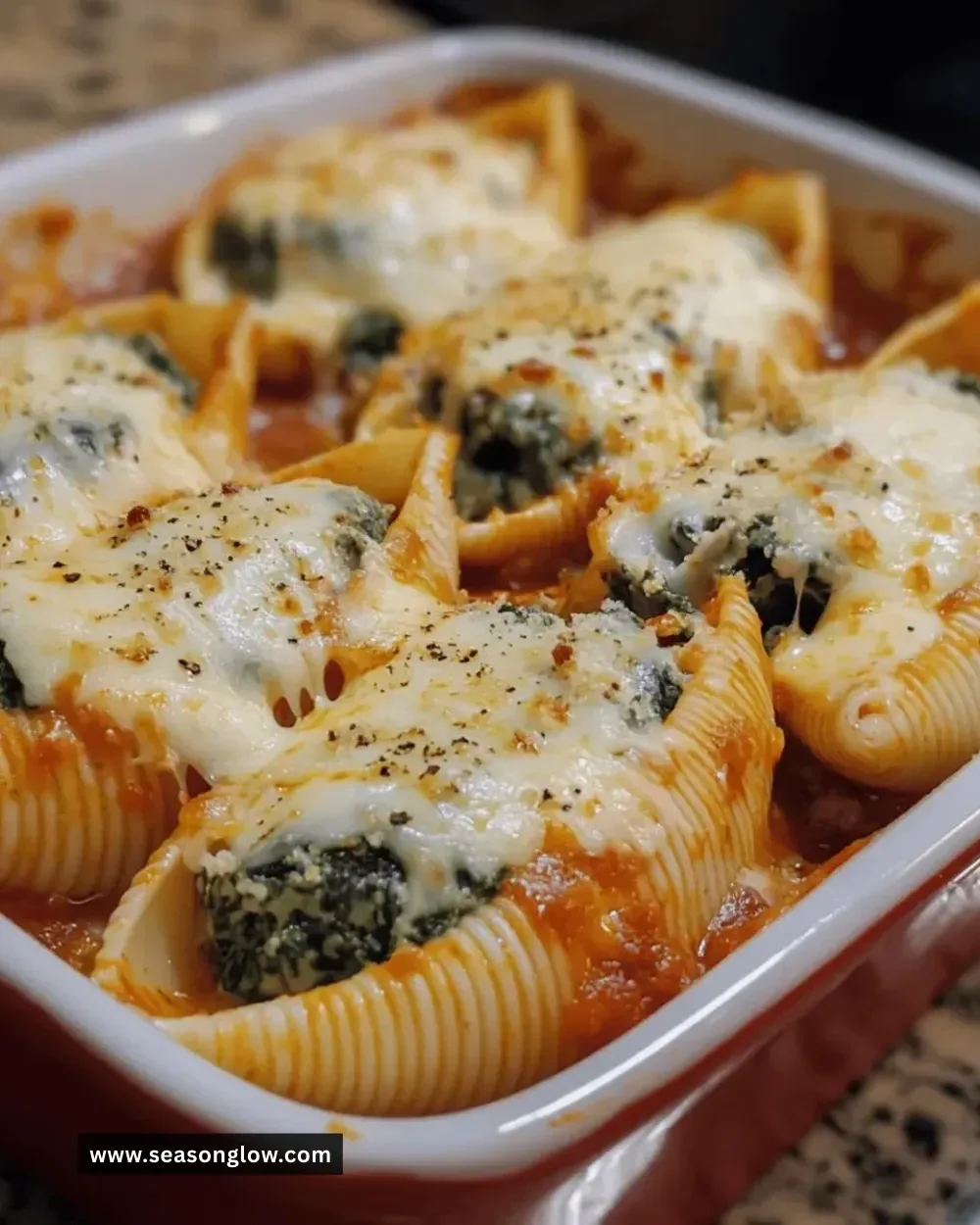 Easy cheesy spinach stuffed shells ready to serve on a plate
