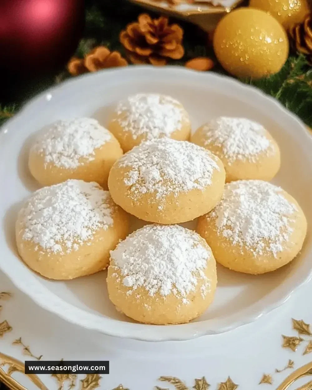 Batch of delicious Easy Christmas Almond Snowball Cookies on a festive plate