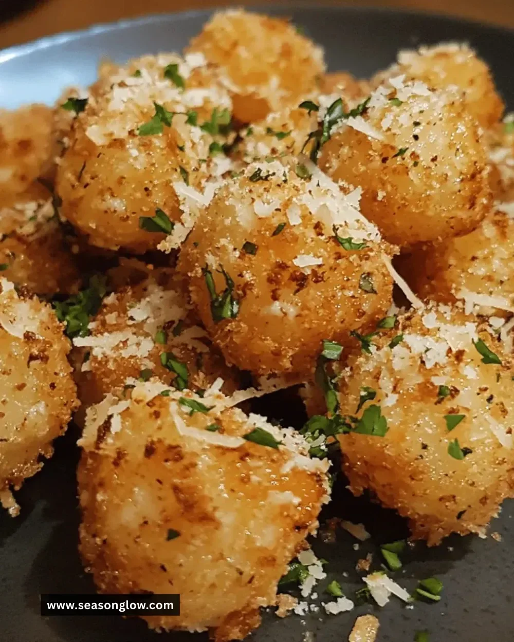 Plate of easy crispy garlic parmesan bites ready to eat.