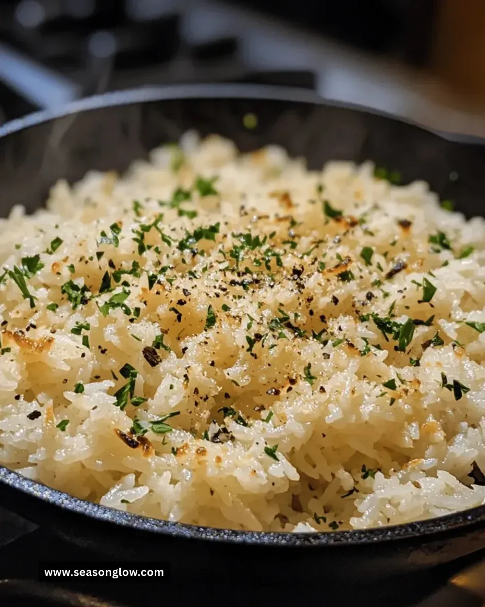 Easy garlic parmesan rice skillet served with herbs and cheese