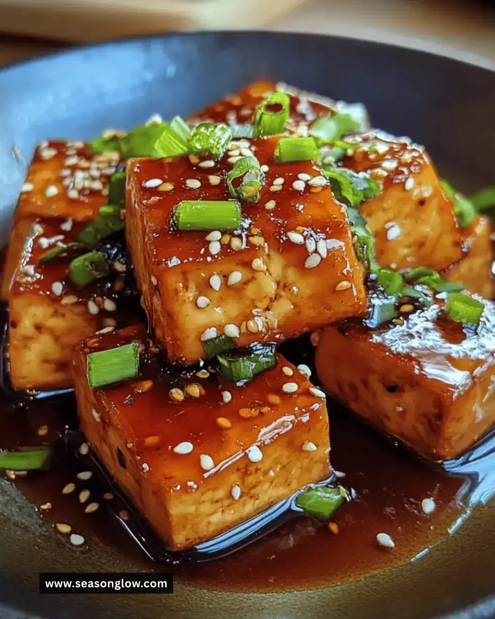 Easy honey soy glazed tofu served on a plate with vegetables