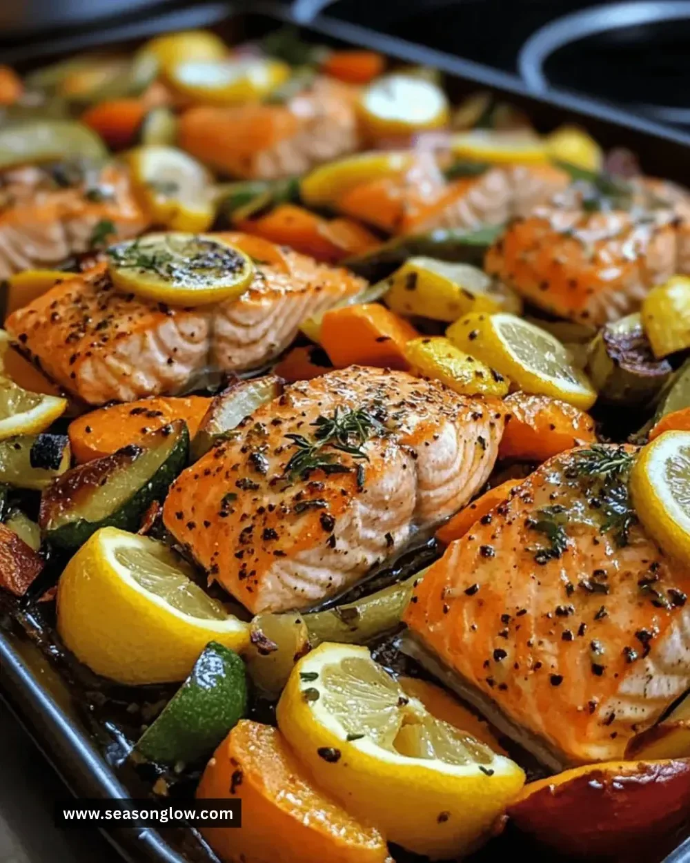Lemon-herb sheet-pan salmon with colorful vegetables ready to serve