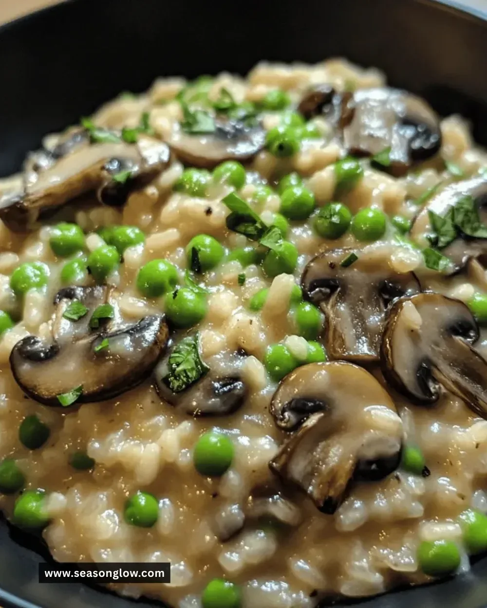 One-pot mushroom and pea risotto garnished with herbs