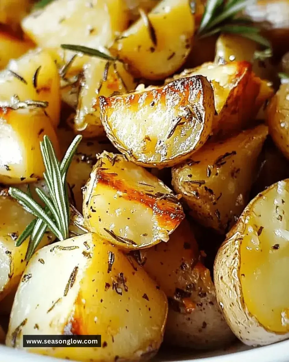 Easy rosemary garlic roasted potatoes served in a white bowl