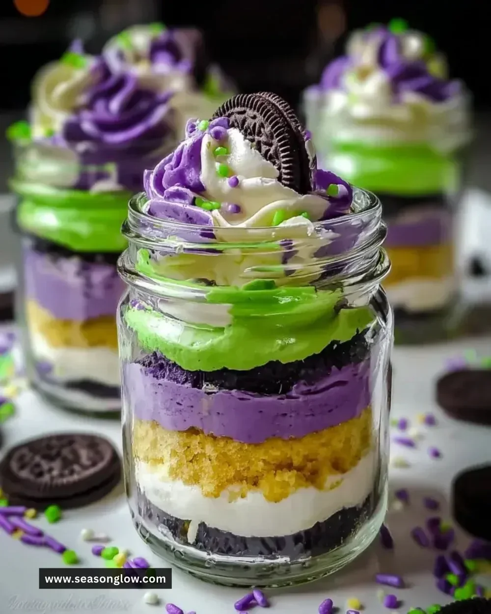 Ghoulishly fun Beetlejuice mini trifles served in jars for a spooky dessert.
