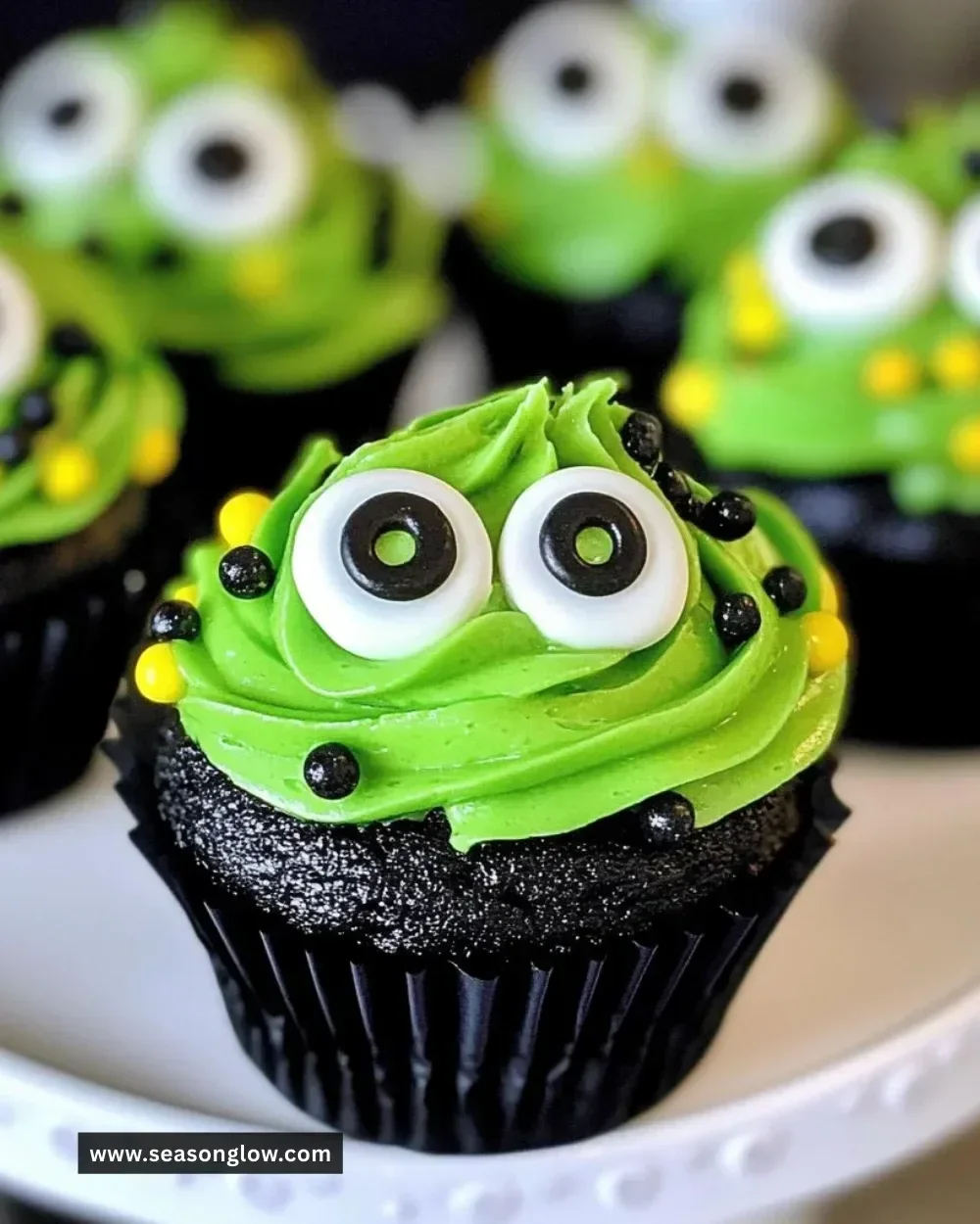 Halloween slime cupcakes decorated with gooey slime and spooky toppings.