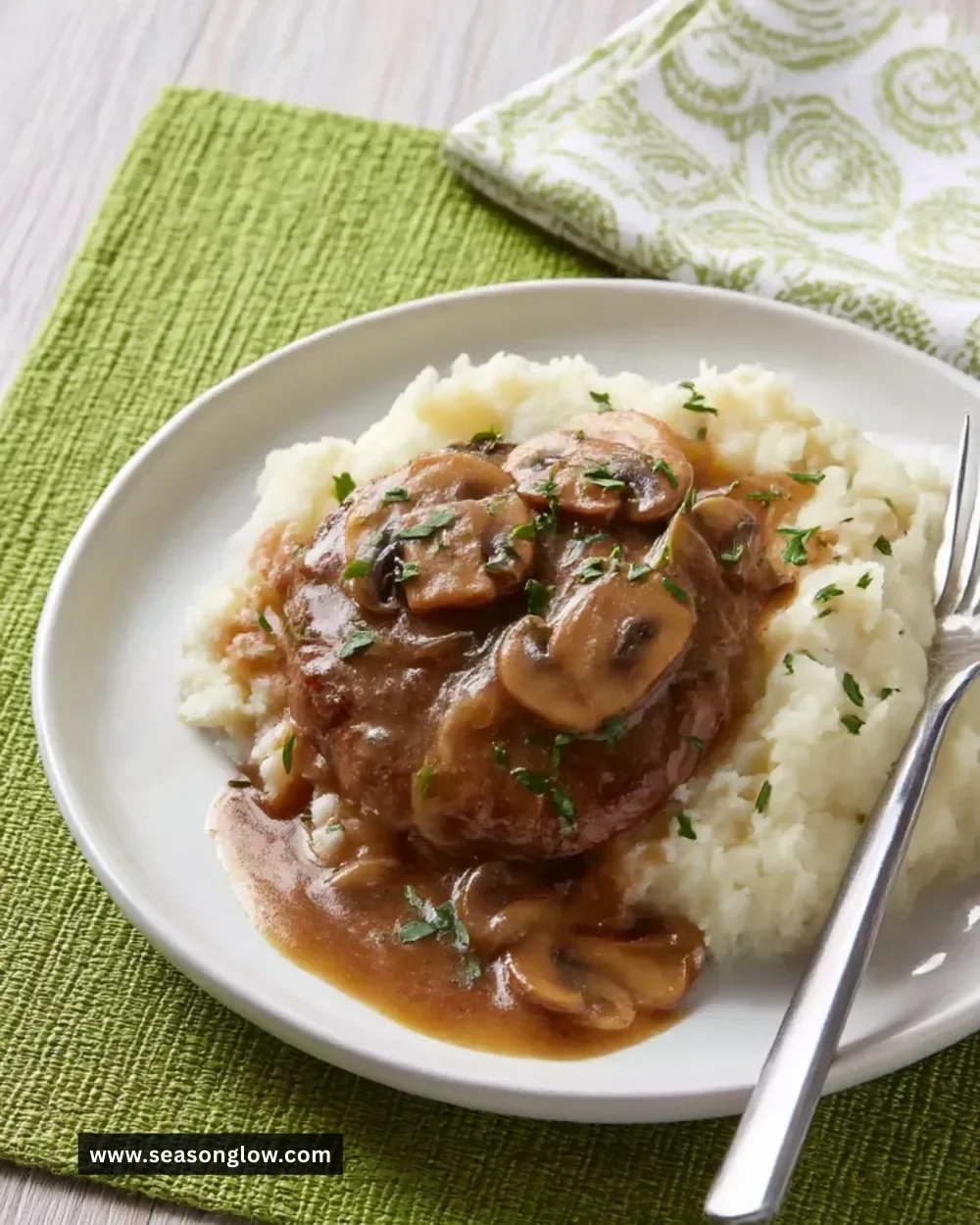 Hamburger steaks served with luscious onion and mushroom gravy.