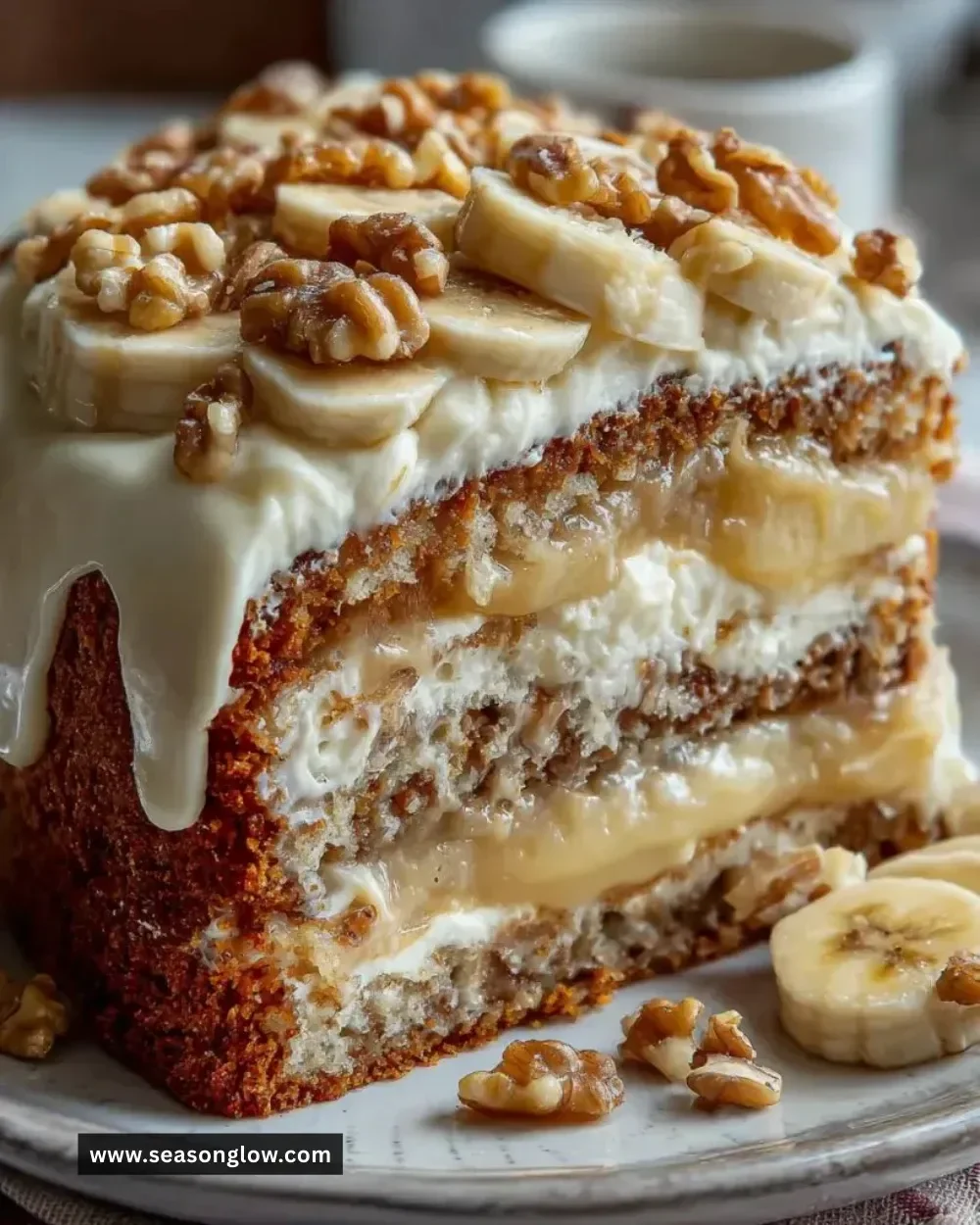 Heavenly Banana Walnut Cream Cake topped with walnuts and banana slices