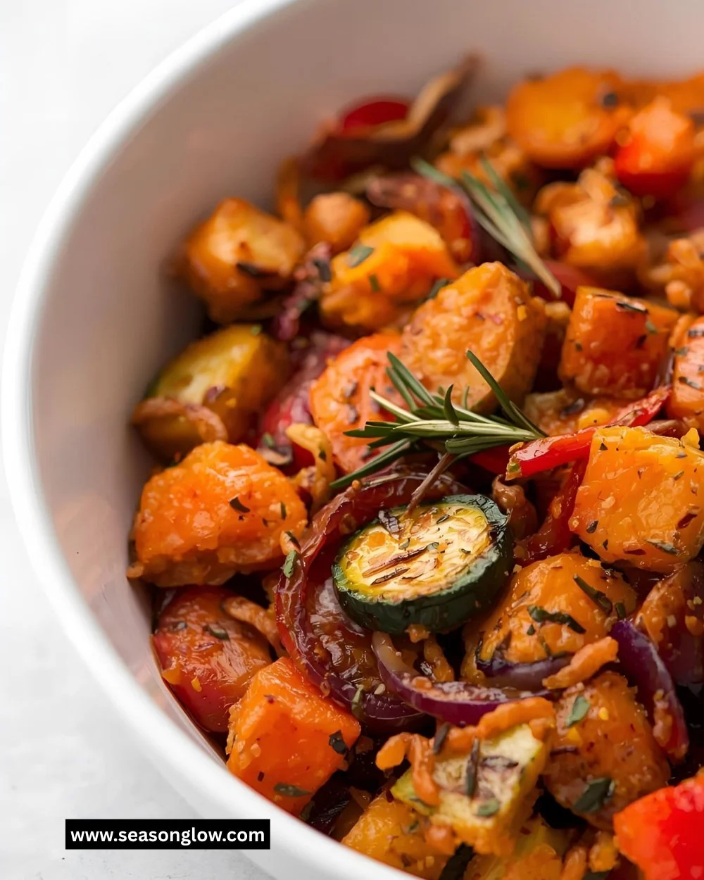 Colorful herb roasted vegetable medley with bell peppers, zucchini, and carrots