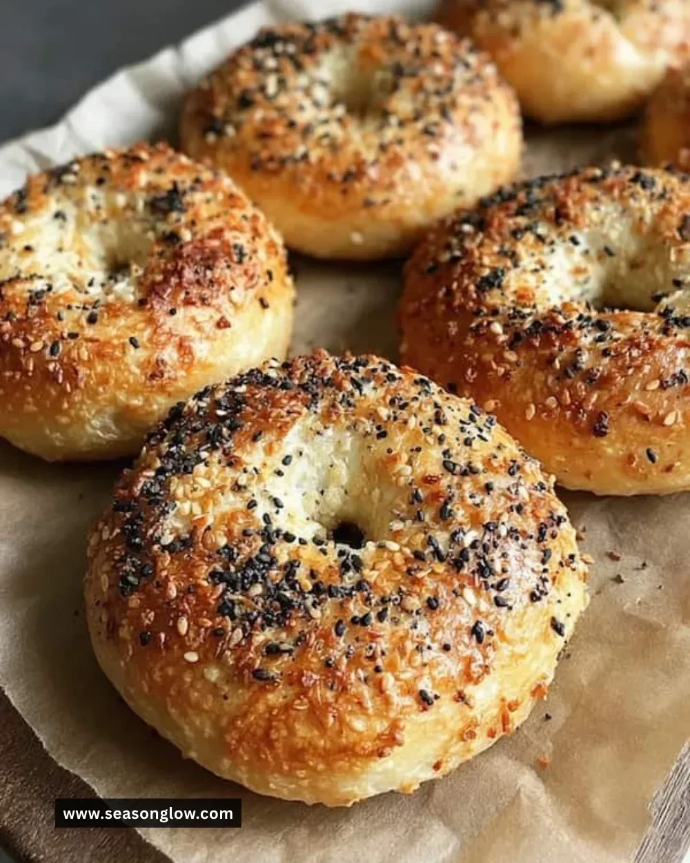 Freshly baked homemade New York bagels on a wooden table