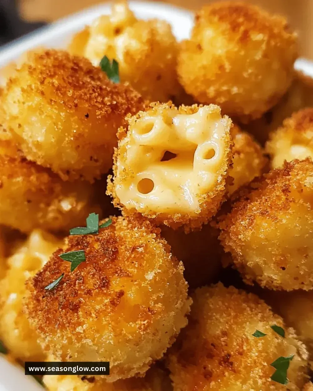 Irresistible baked mac and cheese bites served on a platter.