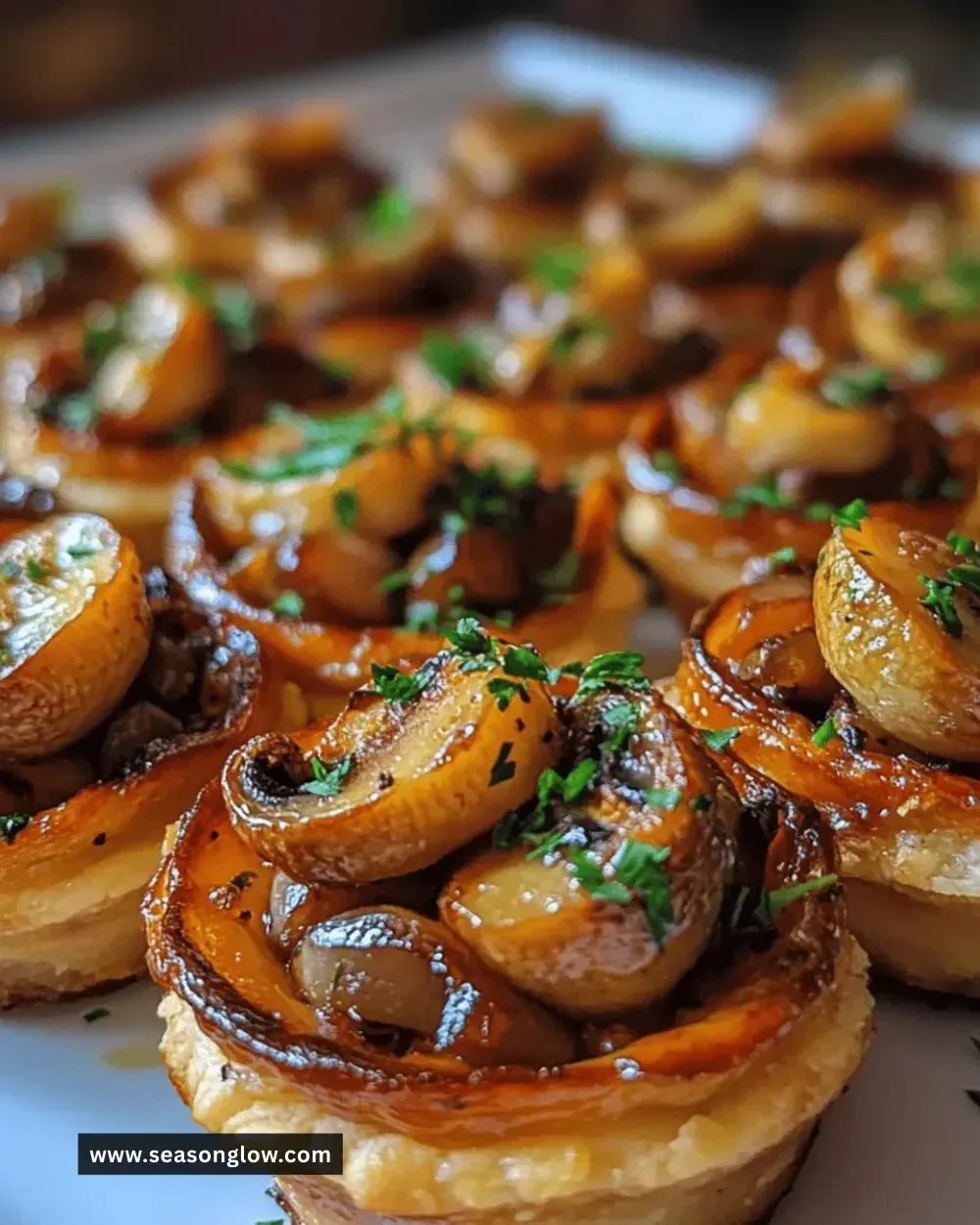 Plate of irresistible mini mushroom tart bites ready to serve.
