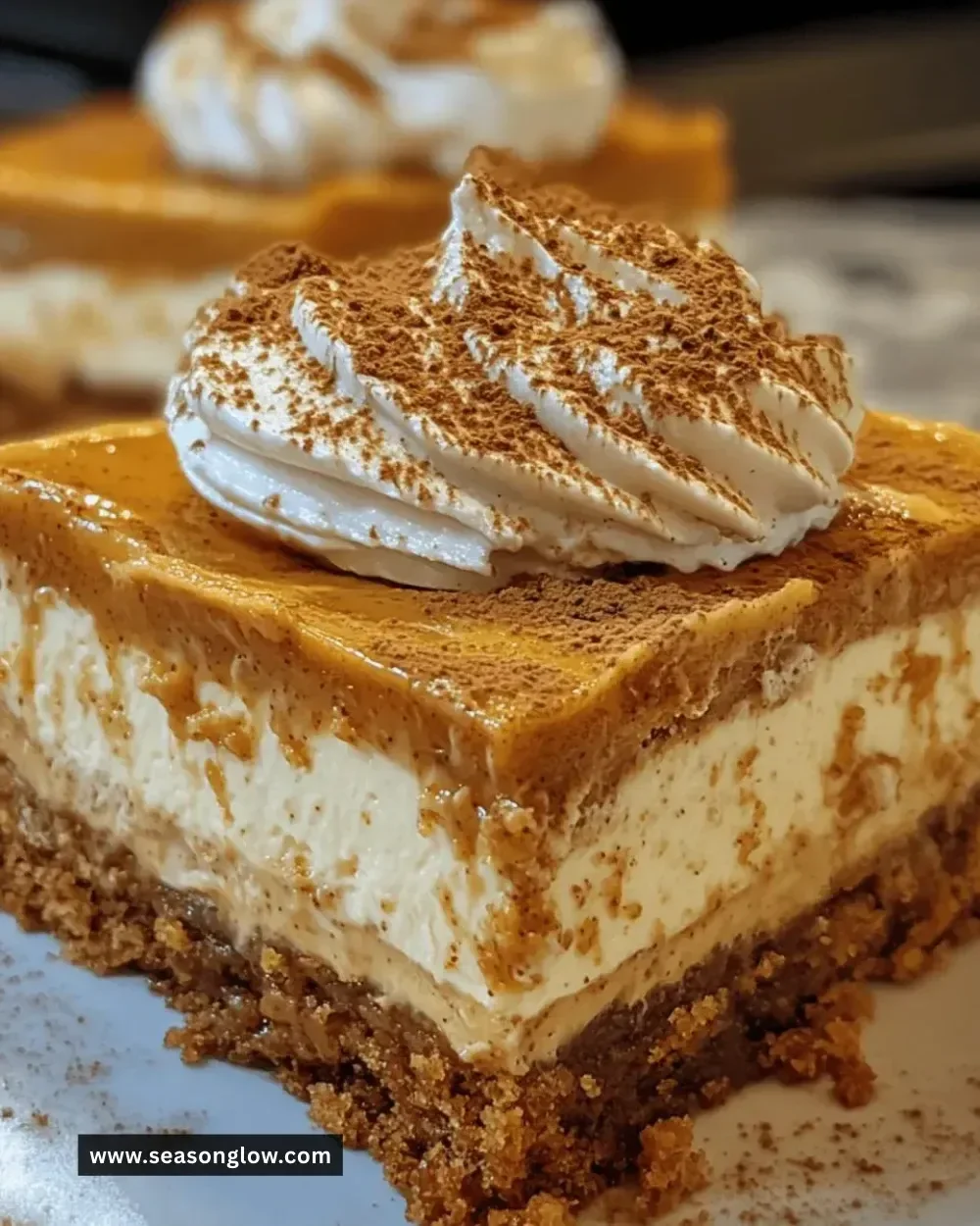 Irresistible pumpkin spice cheesecake bars with a creamy texture and seasonal spices