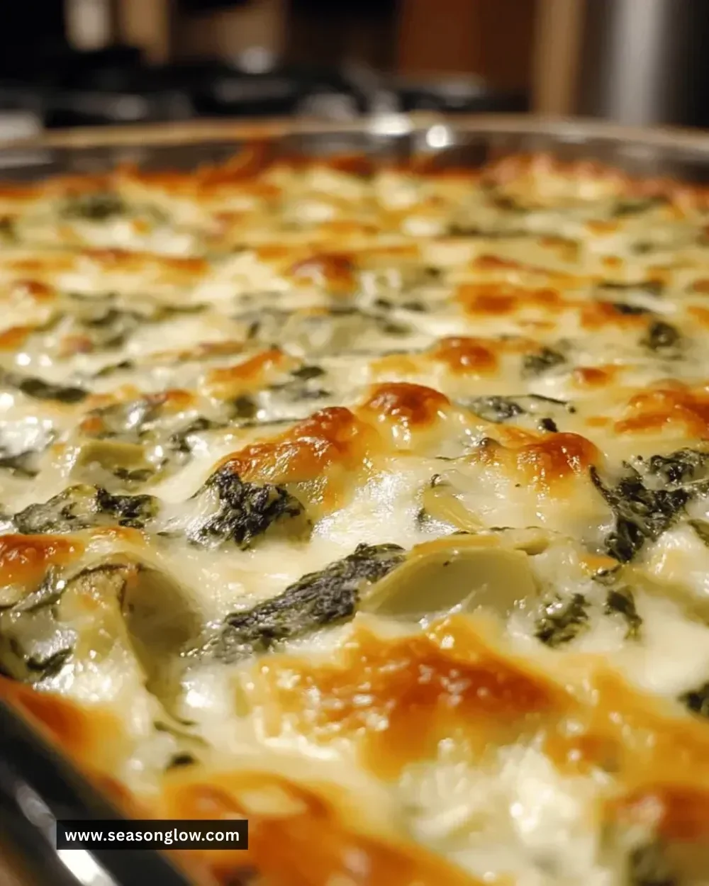 Deliciously creamy spinach artichoke dip served in a bowl with tortilla chips