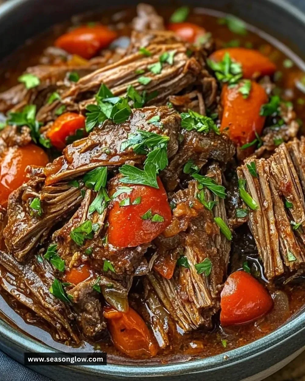 Delicious Italian Beef Pot Roast served with vegetables and herbs.