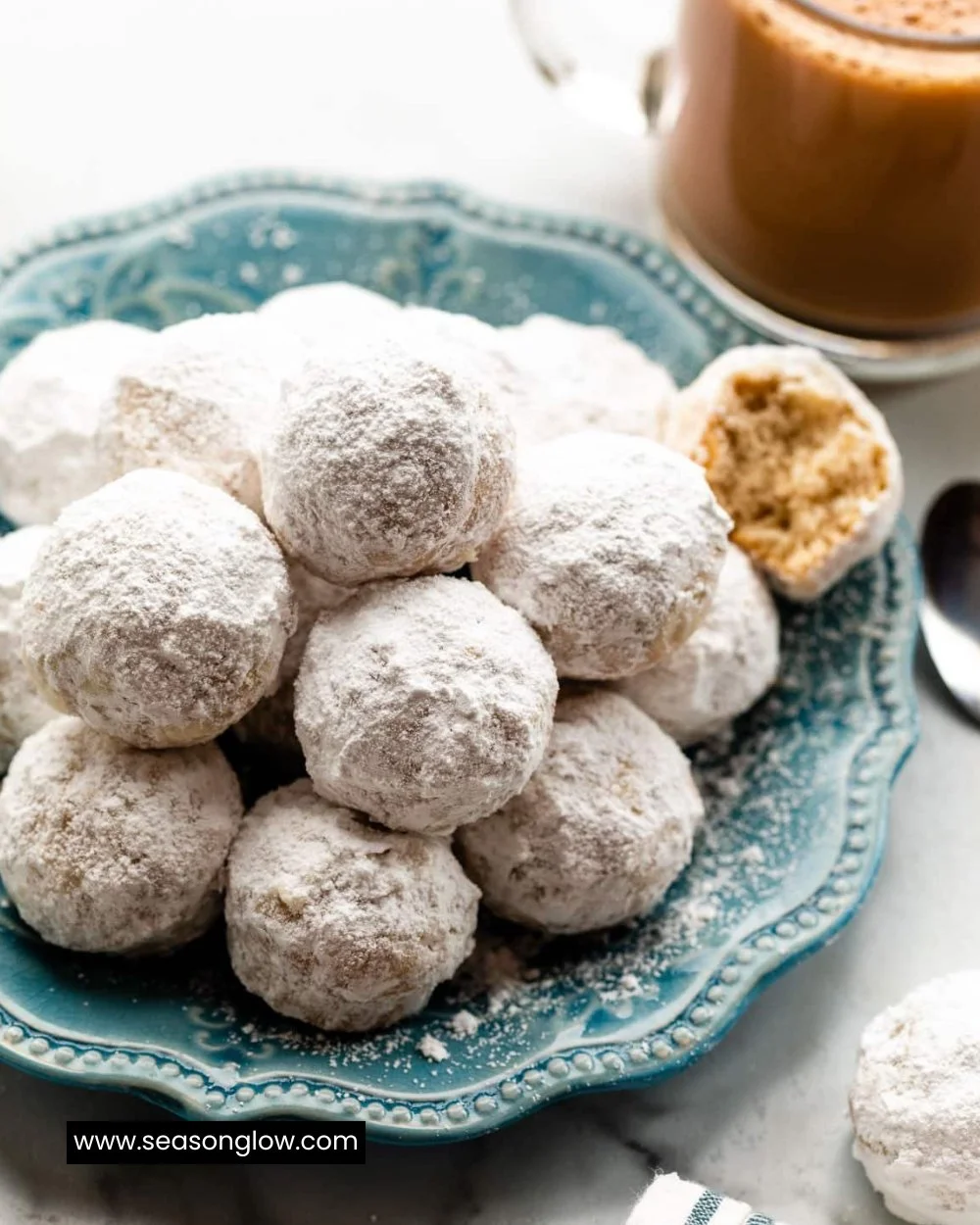 Delicious mini powdered sugar donut muffins dusted with powdered sugar on a plate.