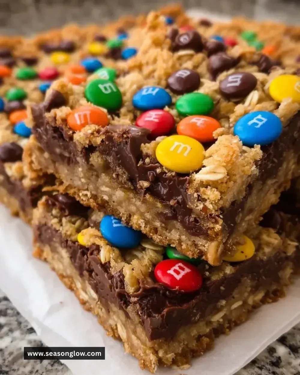 M&M chocolate fudge oatmeal bars topped with colorful candies