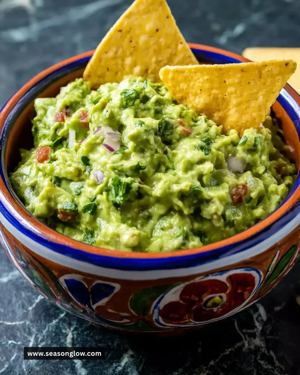 Bowl of perfect guacamole made with fresh avocados and spices