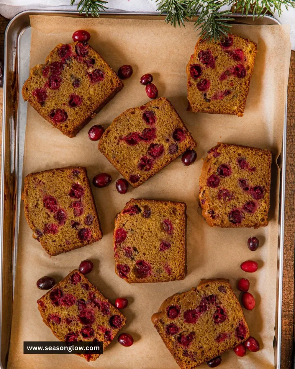 Delicious slice of Pumpkin Cranberry Bread with cranberries and spices