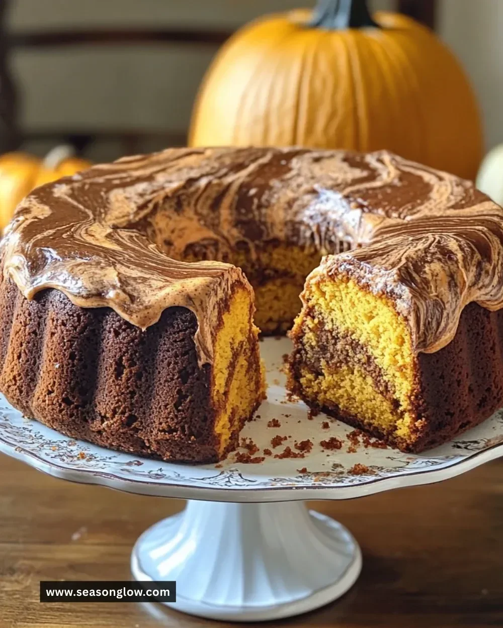 Vegan Pumpkin Marble Cake with chocolate swirls on a rustic wooden table