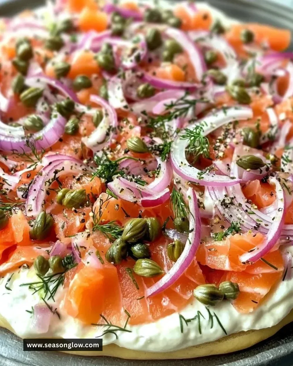 Delicious smoked salmon dip served with bagels and garnished with herbs