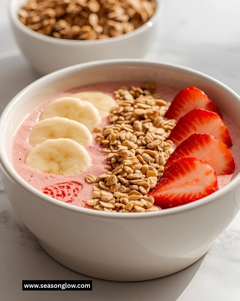 Strawberry Banana Smoothie Bowl topped with fresh fruits and granola
