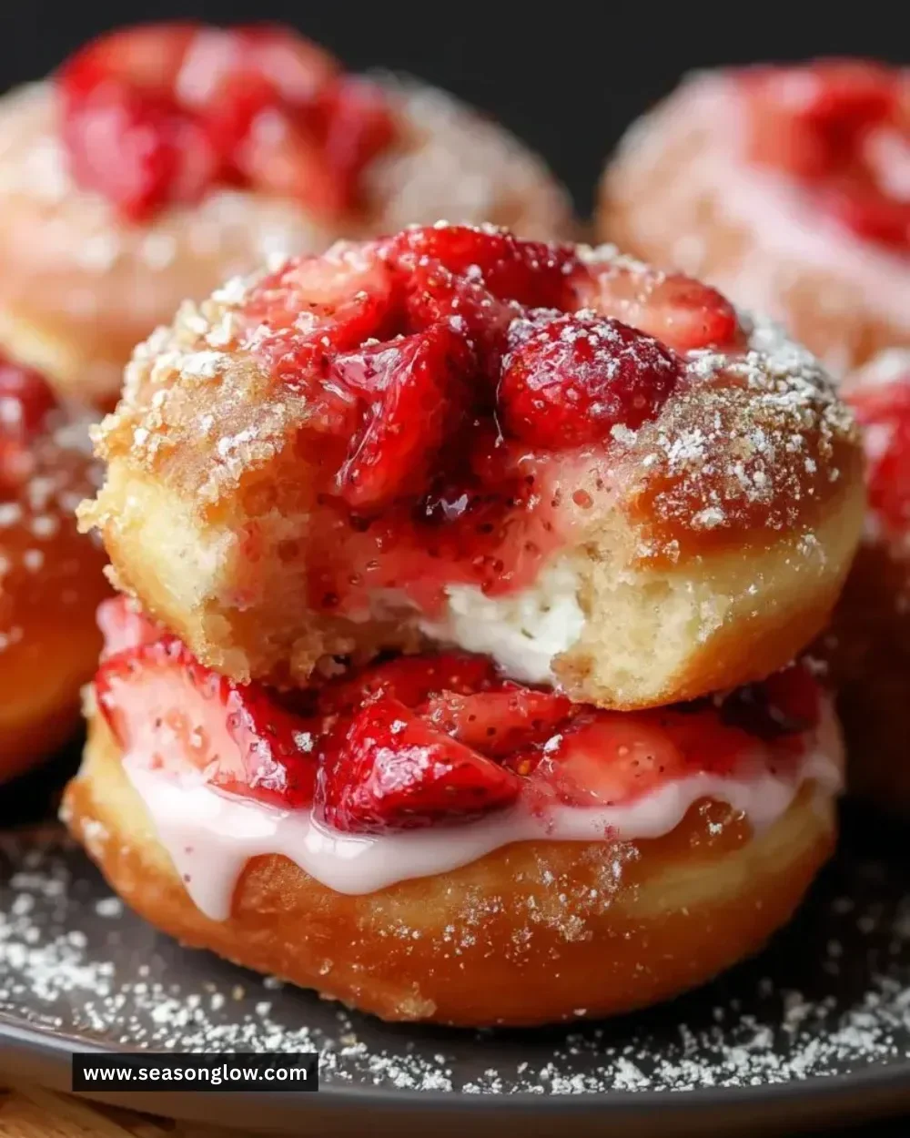 Delicious strawberry cheesecake stuffed donuts with creamy filling and strawberry topping