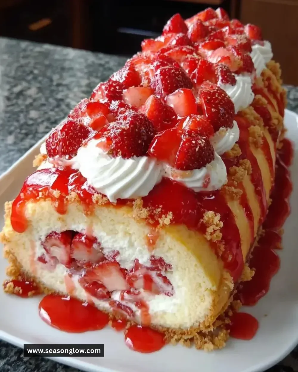 Delicious Strawberry Shortcake Cheesecake topped with fresh strawberries