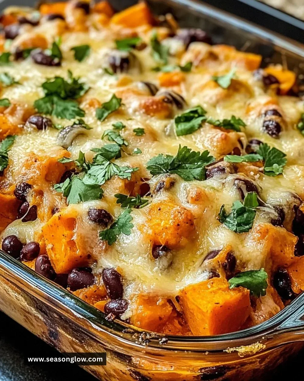 Sweet Potato and Black Bean Casserole topped with crunchy pecans